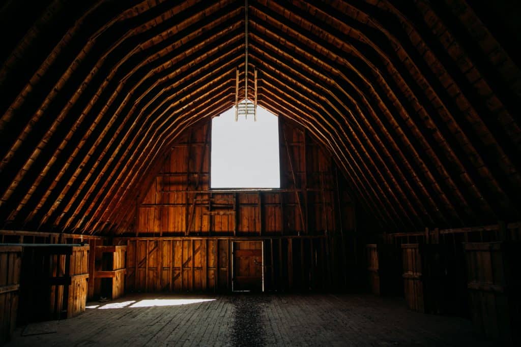 picture of an empty pole barn with a window